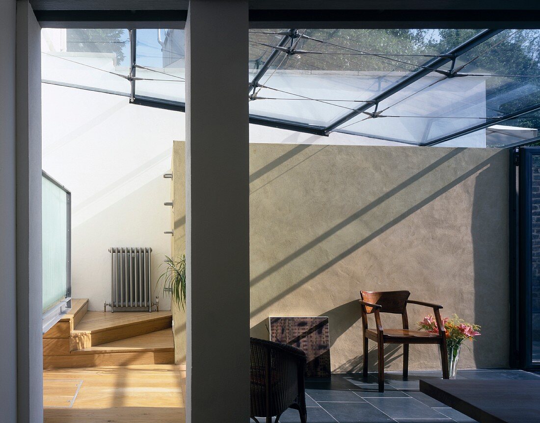 Dining room with glass roof and slate floor