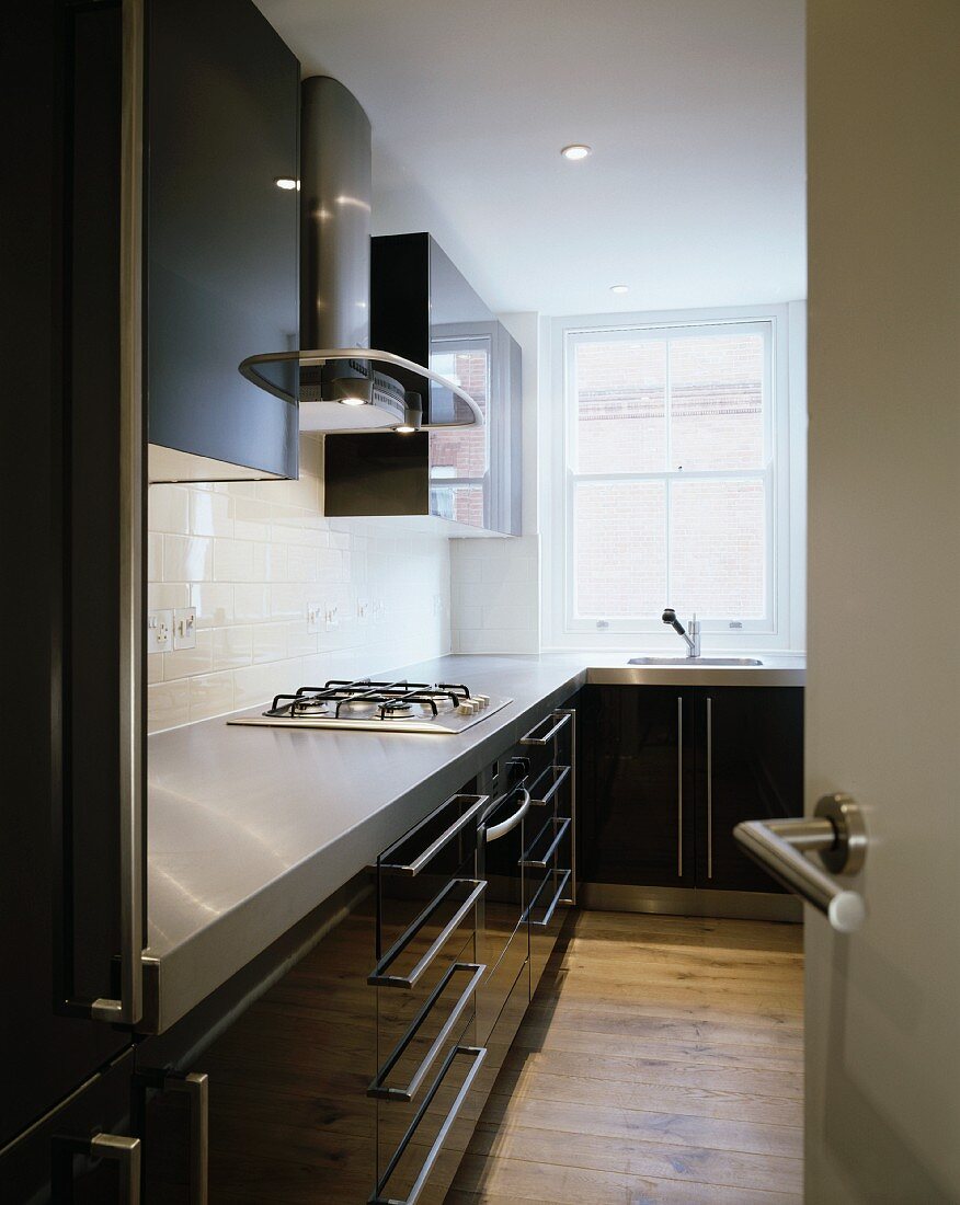 Modern kitchen with fitted cupboards and gas cooker