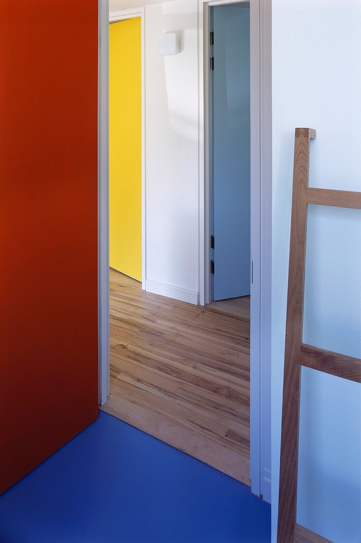 Hallway with doors of various colours