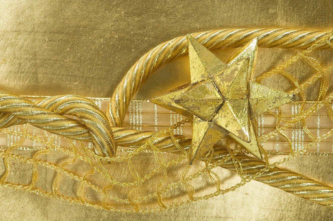 Gold star and ribbons (Christmas decorations)