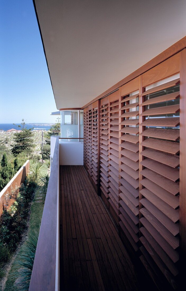 Wooden blinds on balcony windows