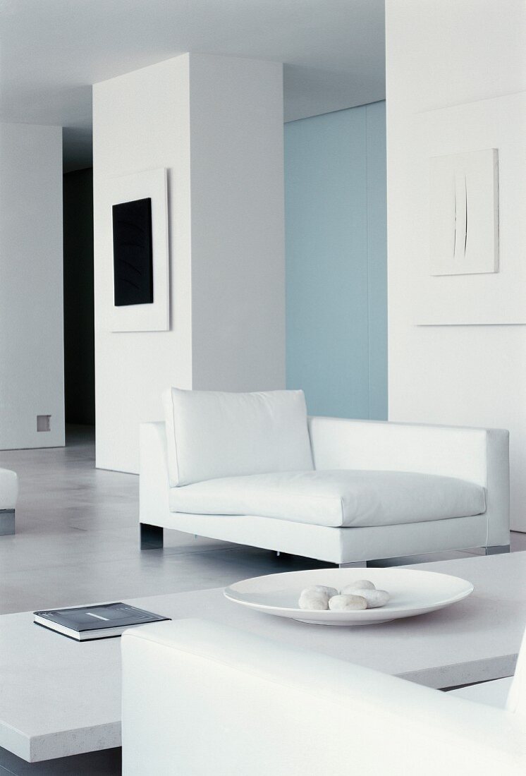 Modern chaise longue in white living room