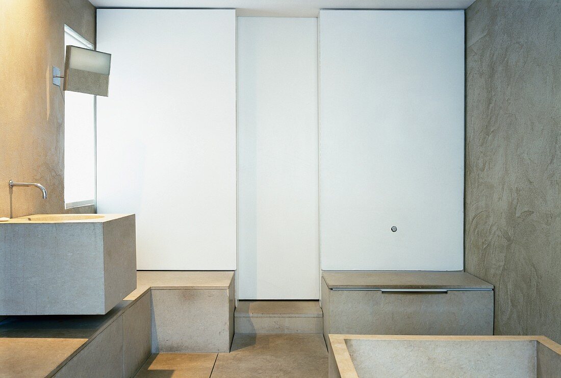 Contemporary bathroom with concrete washstand and surfaces