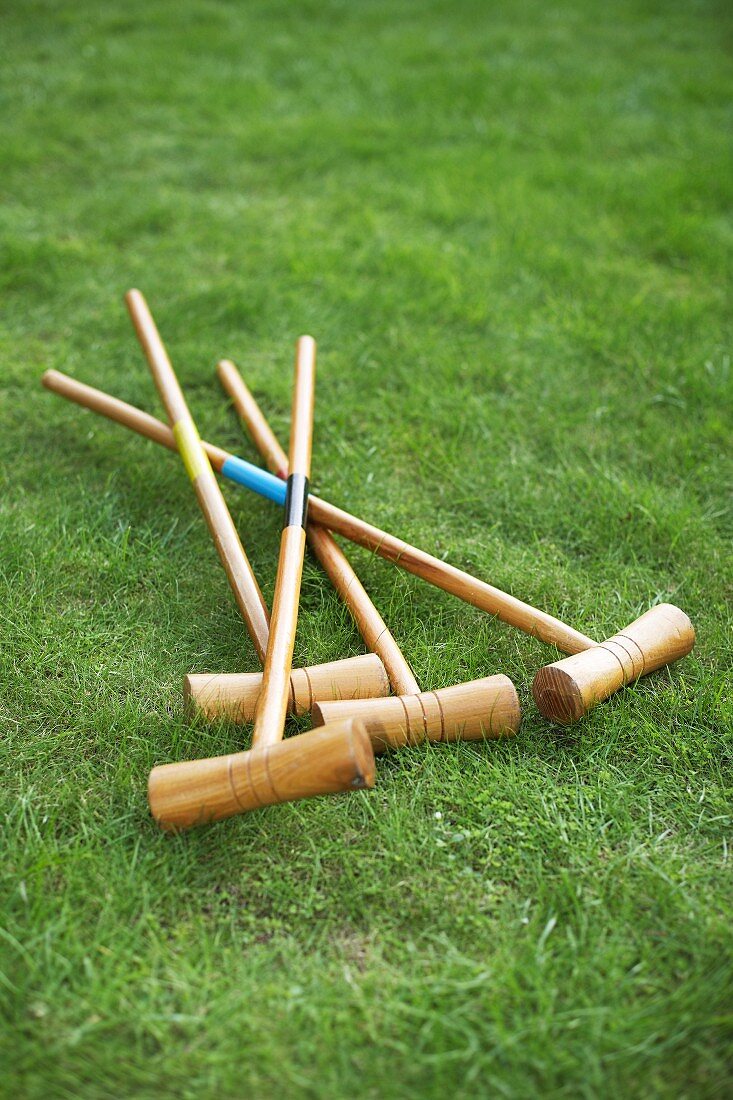 Croquet mallets on lawn