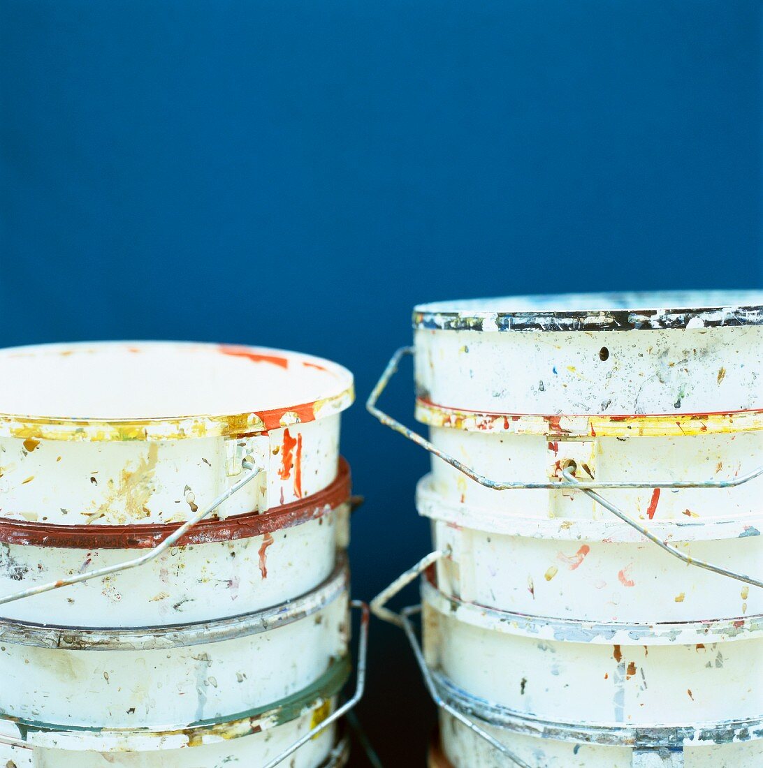 Stacked, empty paint buckets