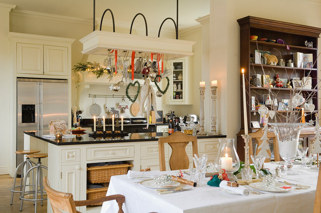 Festive set table in open-plan country house kitchen