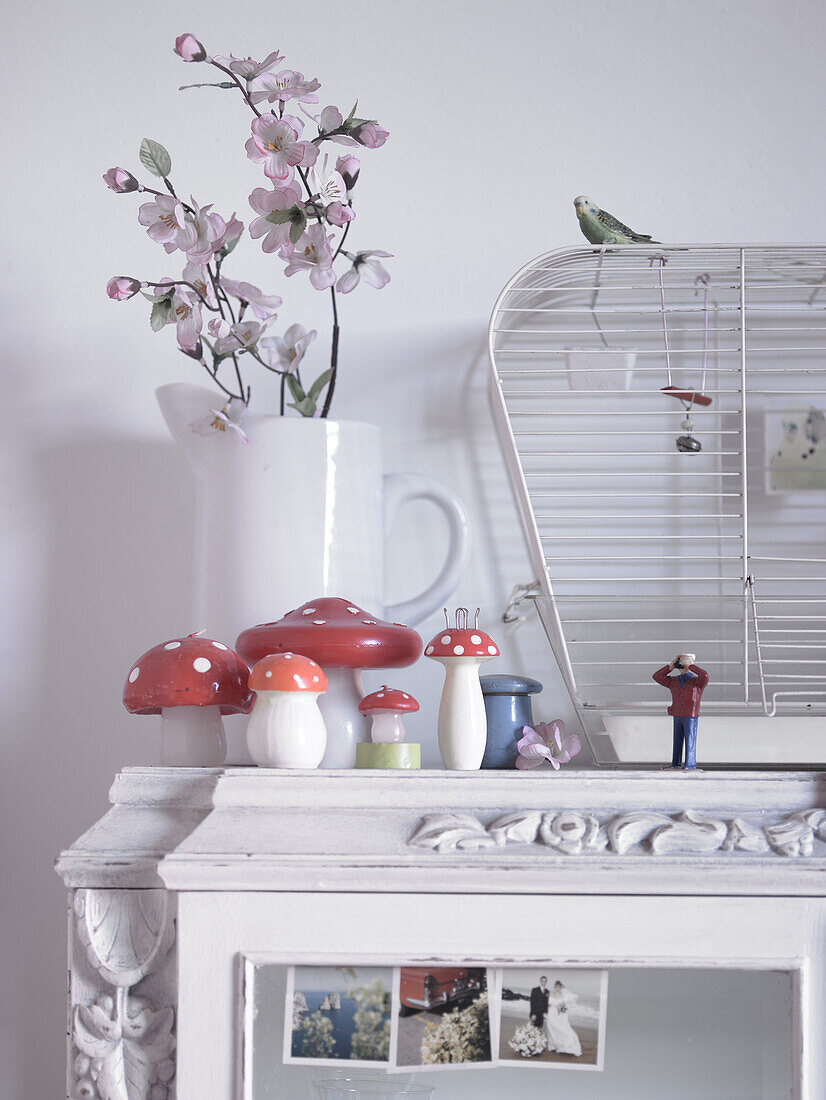 Decorative toadstools, bird and birdcage