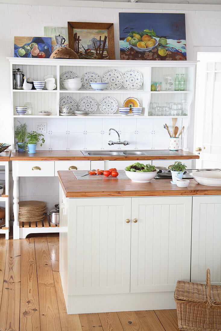 Country-style kitchen with open shelving and crockery collection