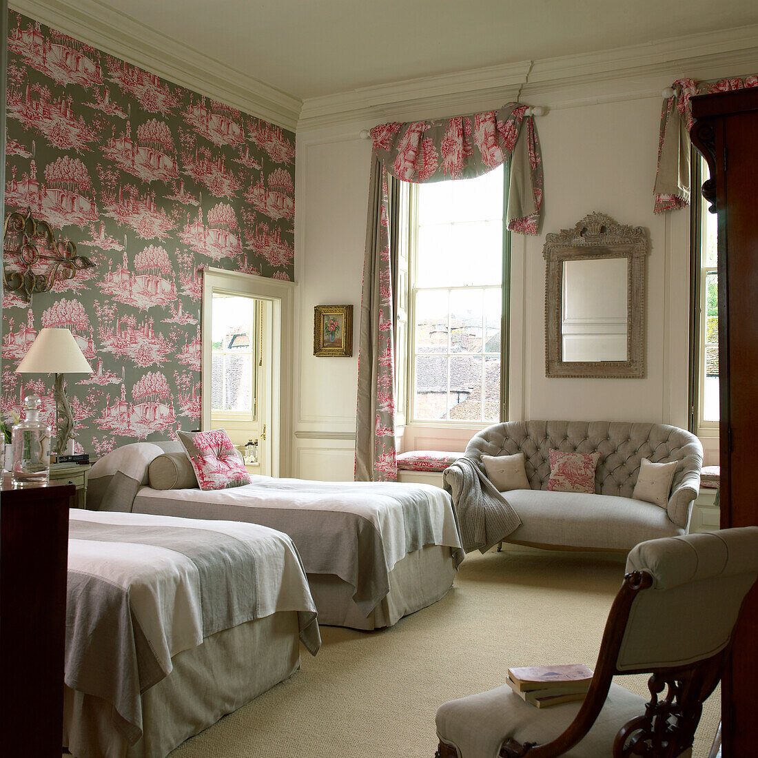 Bedroom with two single beds, wallpaper and curtains in Toile de Jouy pattern