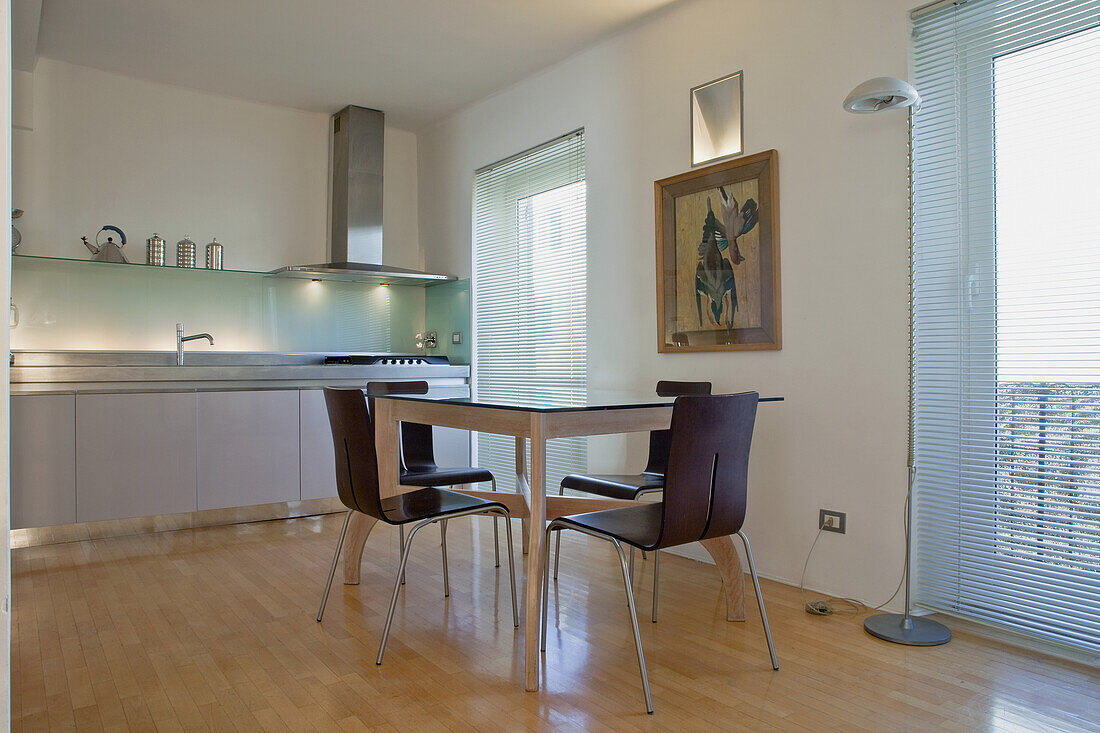 Kitchen with dining table and stainless steel worktop