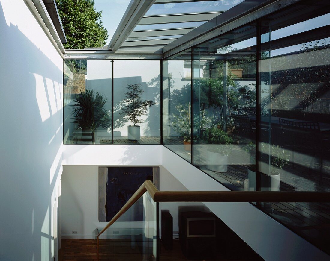 Contemporary stairwell with open glass roof