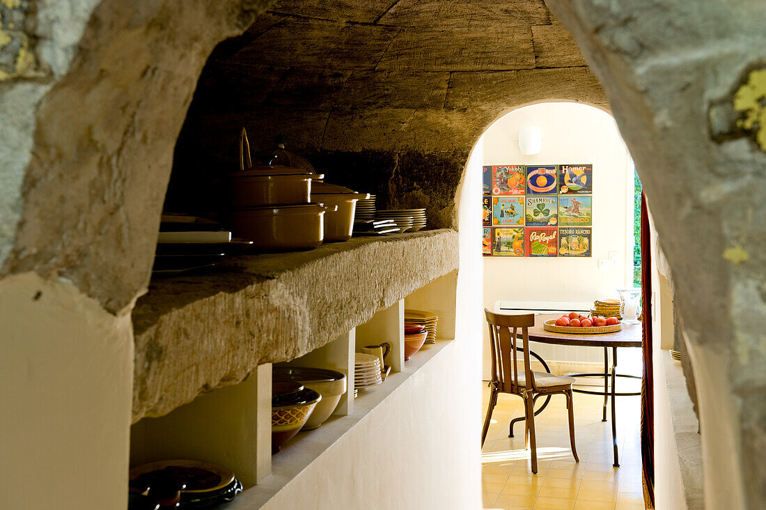 Traditional kitchen furnishings with rustic crockery shelves