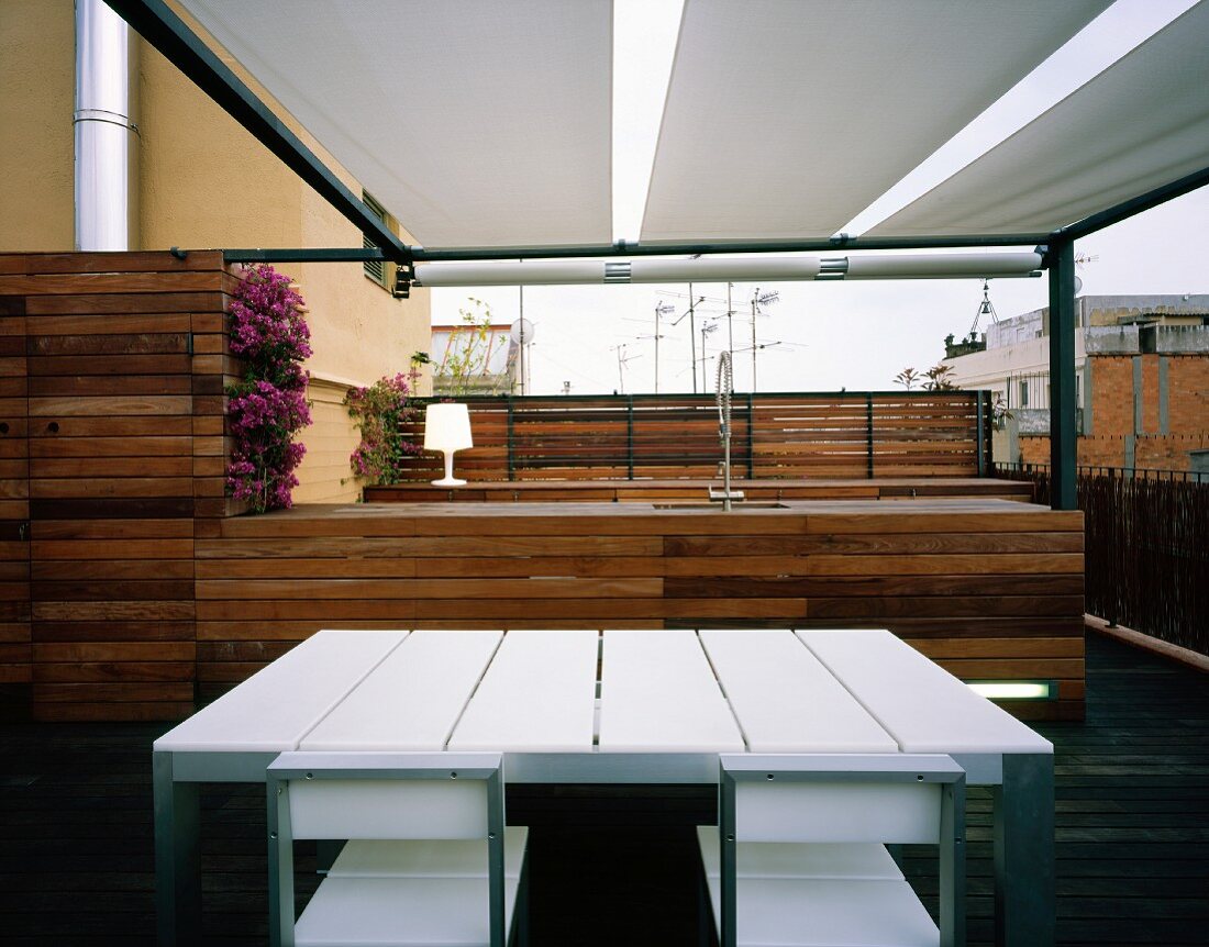 Modern terrace with kitchen, dining table and chairs