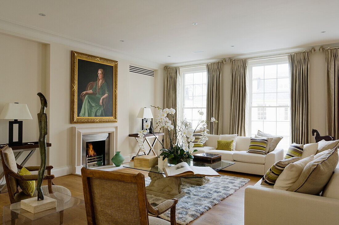 Living room with fireplace and painting above the fireplace