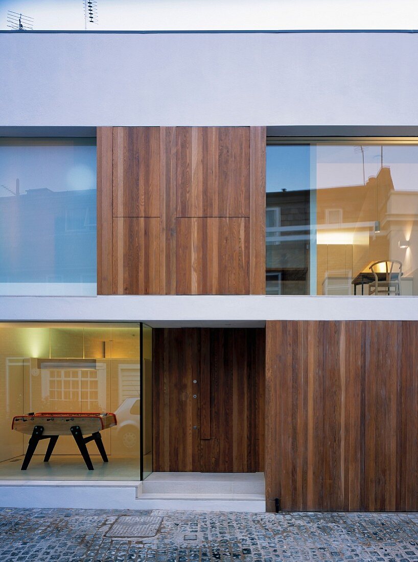 View into cubist house with wood and glass facade