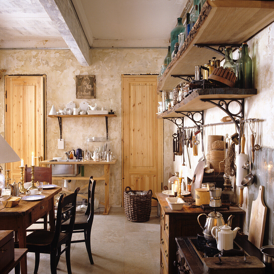 Rustic kitchen with wooden furniture and open shelves full of kitchen utensils