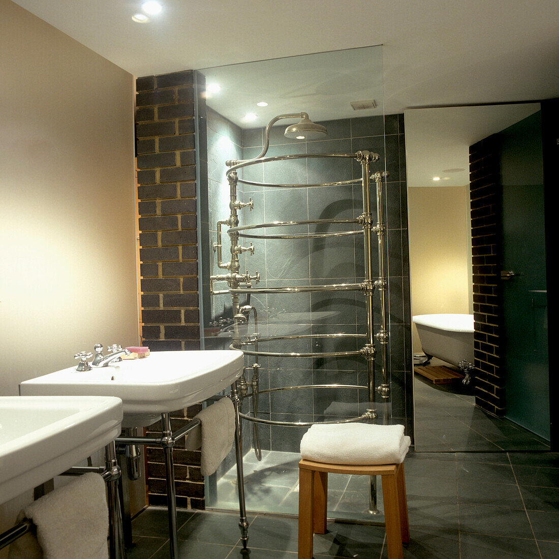 Bathroom with glazed rain shower and black tiles