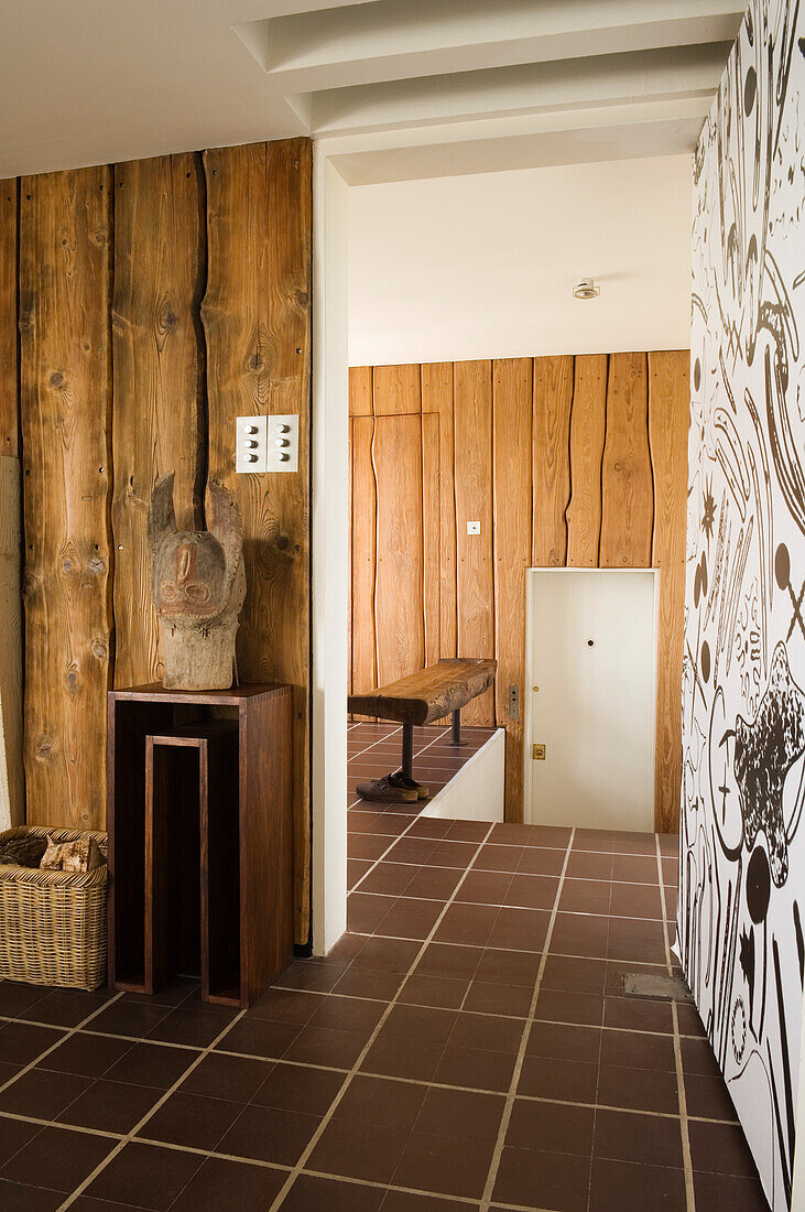 Hallway with wood panelling and rustic decorative elements