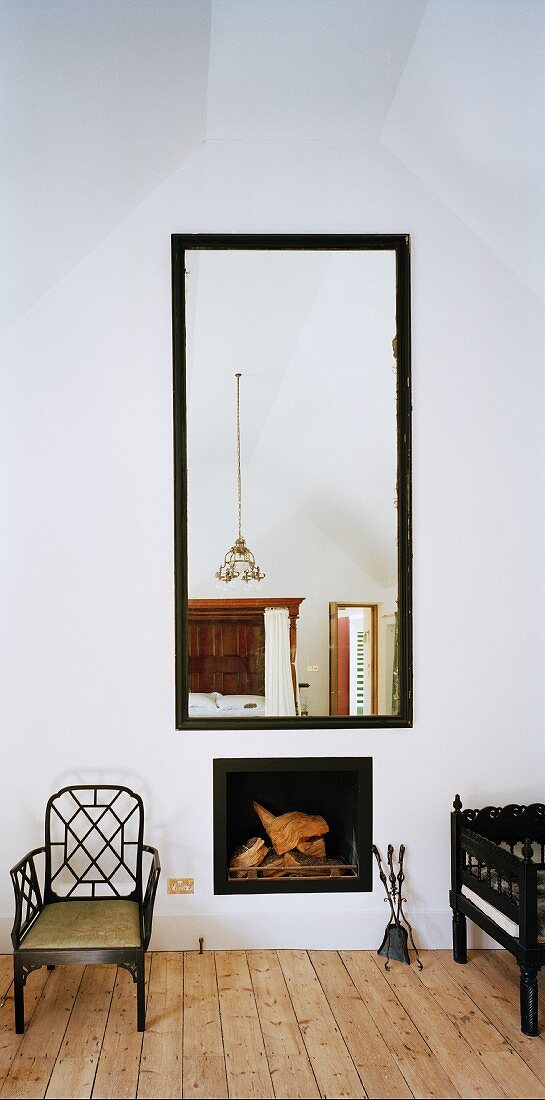 Large mirror above fireplace