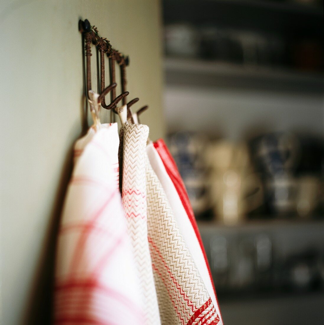 Tea towels hanging on pegs