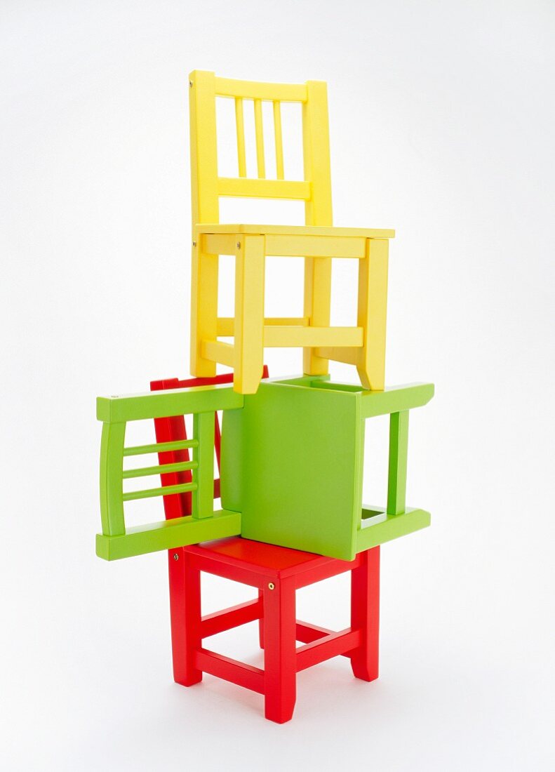 Three colourful children's chairs