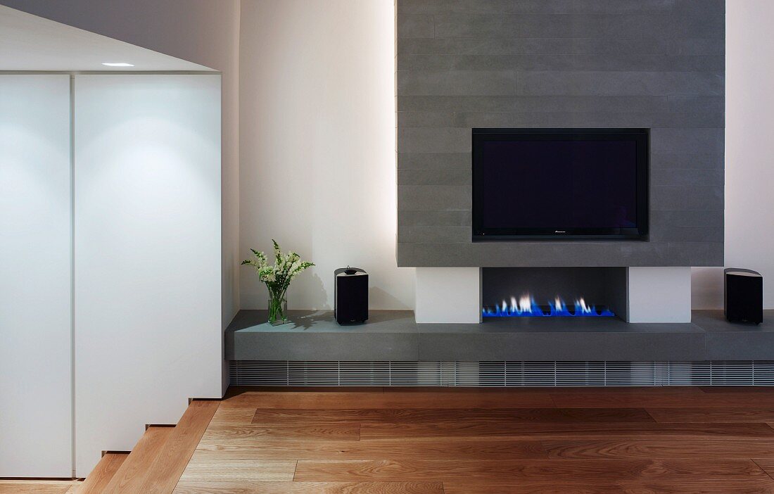 Modern fireplace with integrated flat-screen TV