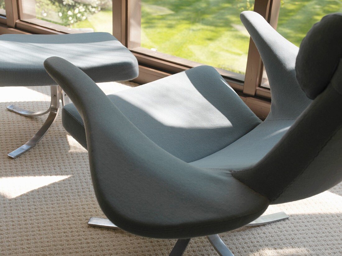Designer armchair with footstool