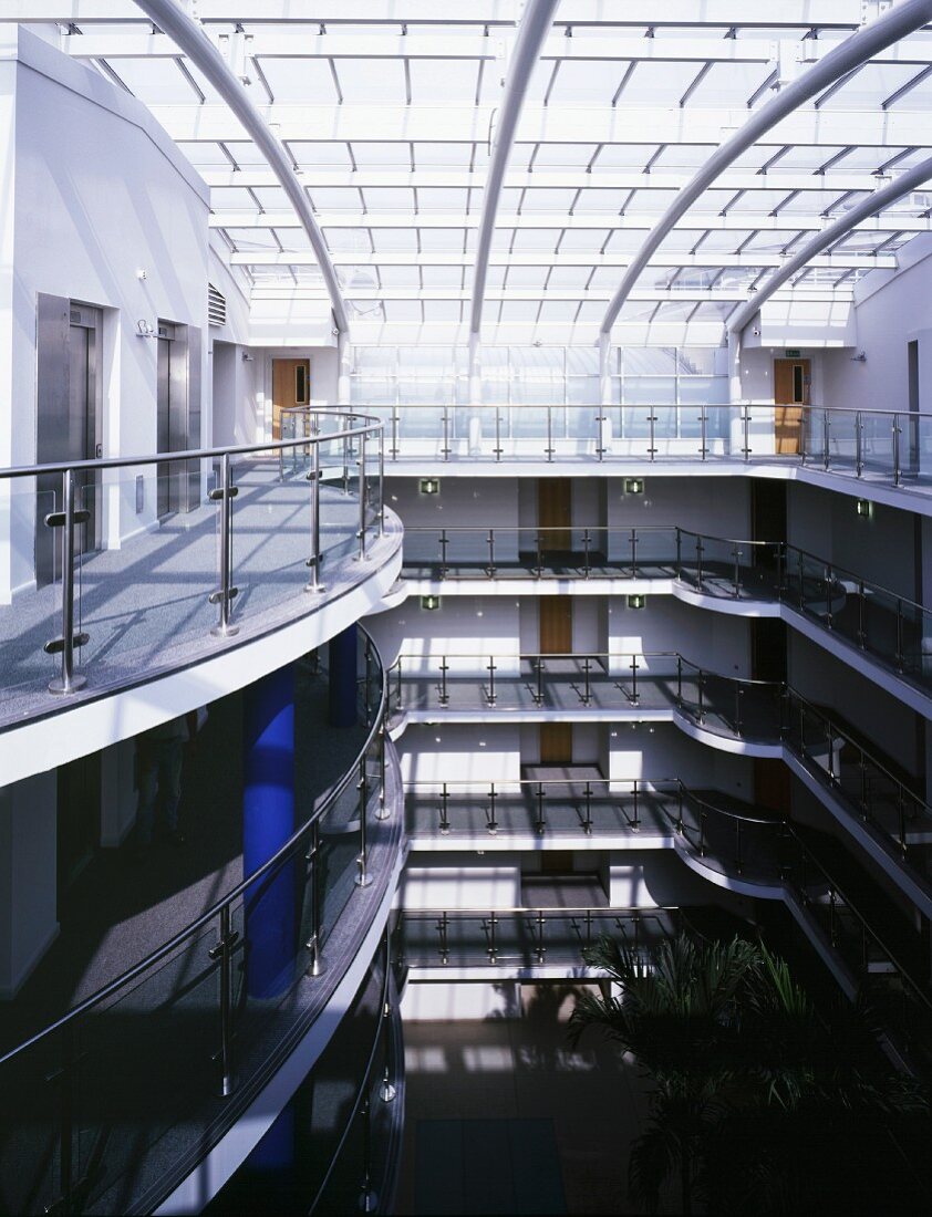 Apartment house with large, glass-roofed arcade lobby