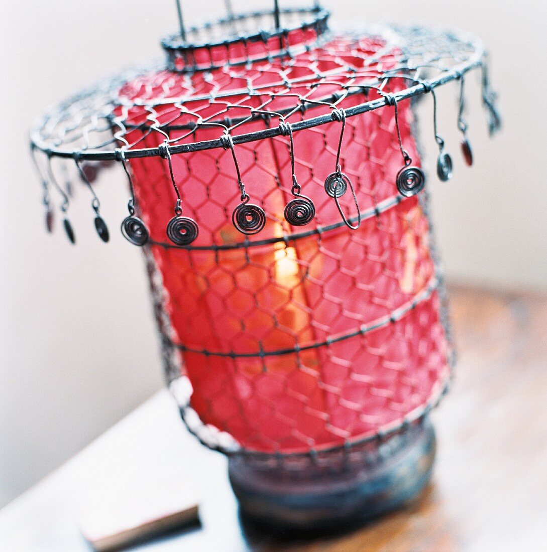 Transparent red paper and wire lantern