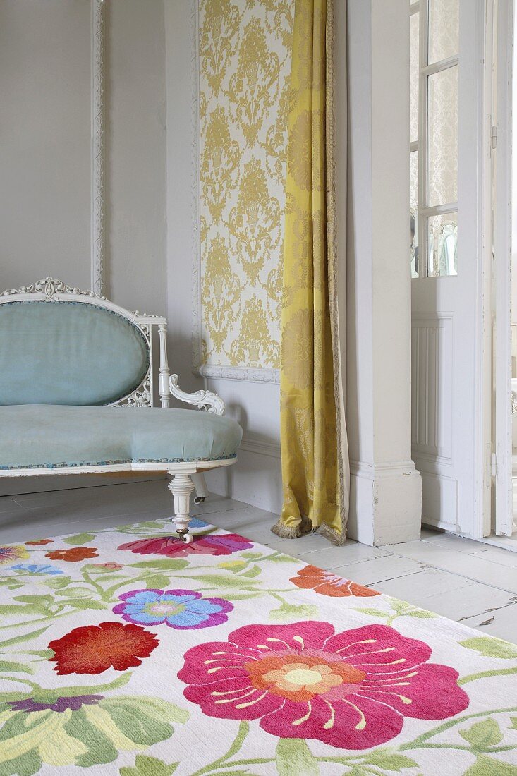 Cheerful floral pattern on rug in front of upholstered, Rococo-style bench