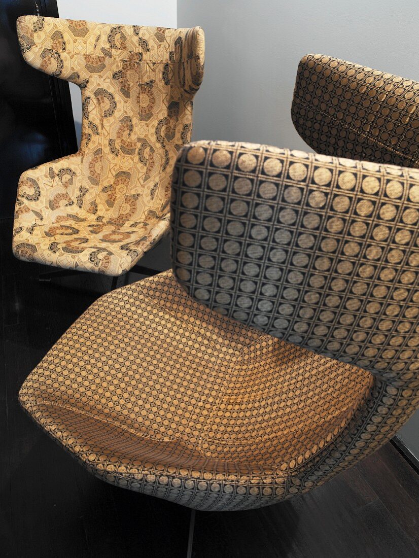 Mix of patterns on shell chairs with brown and beige covers