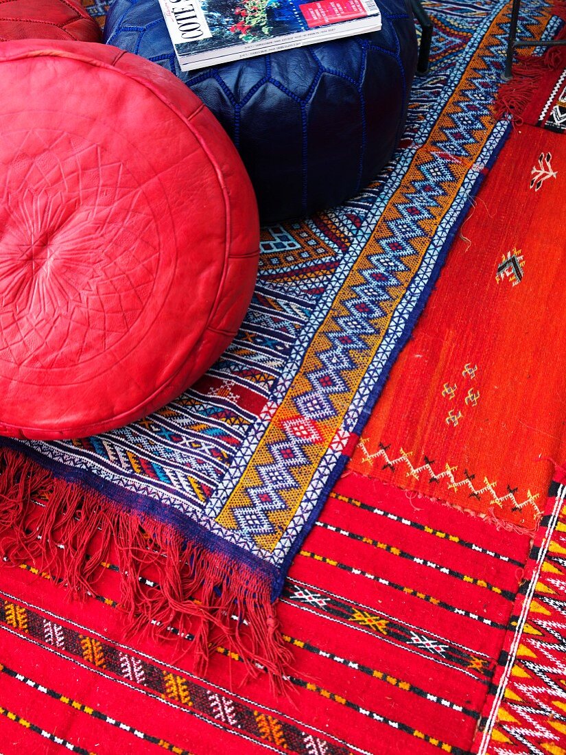 Colourful rugs and floor cushions