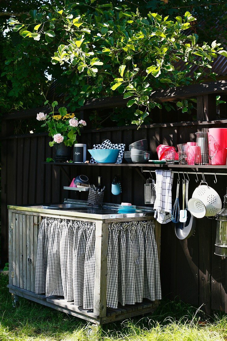 Sink and kitchen utensils in a garden