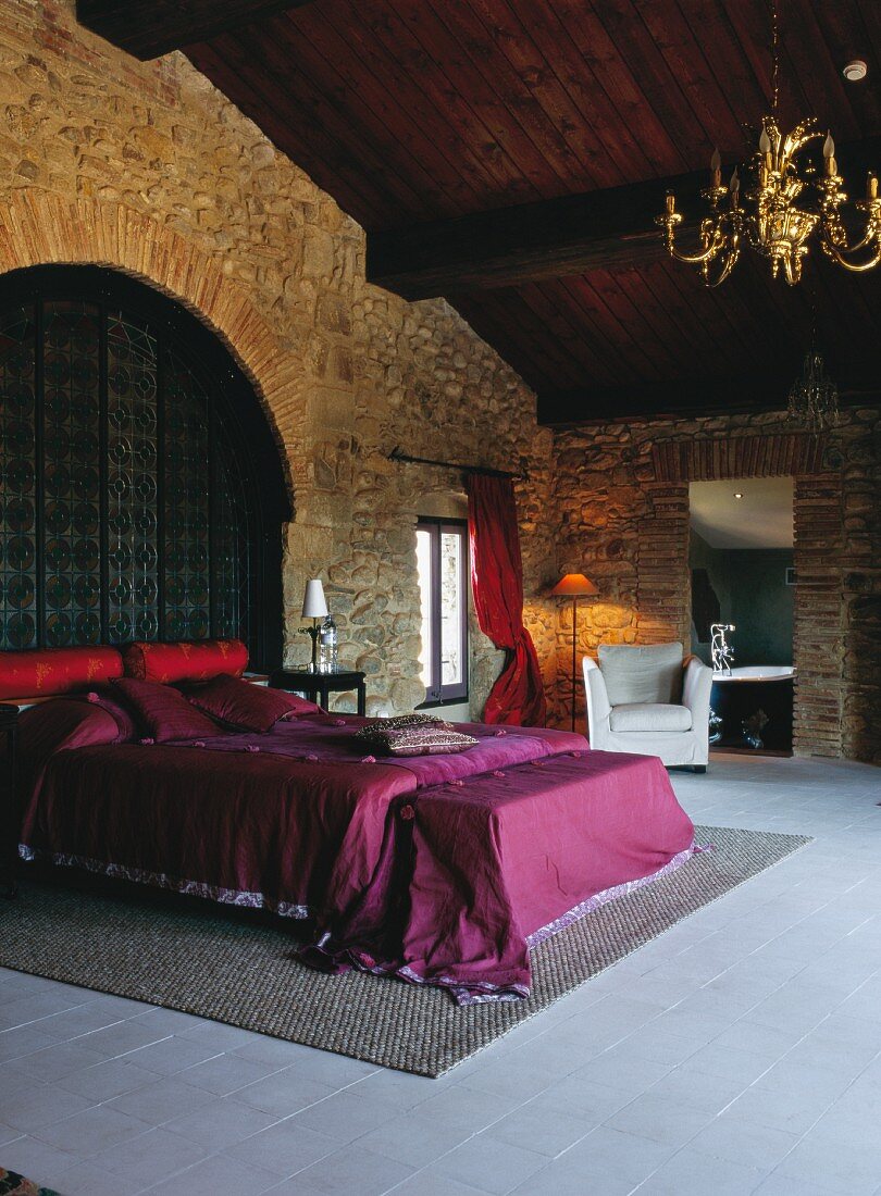 Luxurious bedroom with stone walls