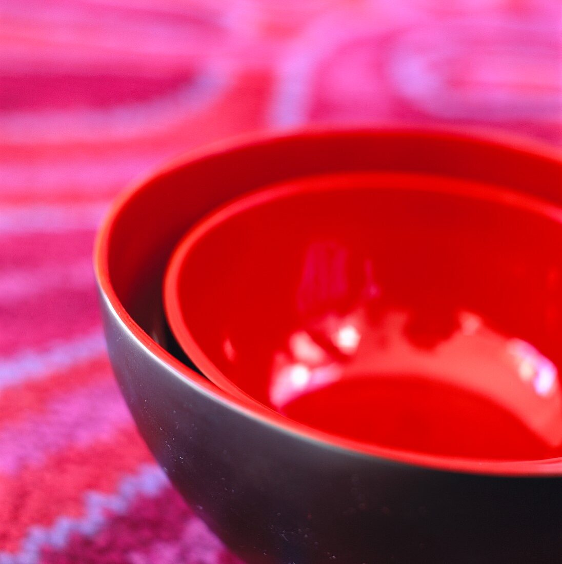 A set of black and red bowls
