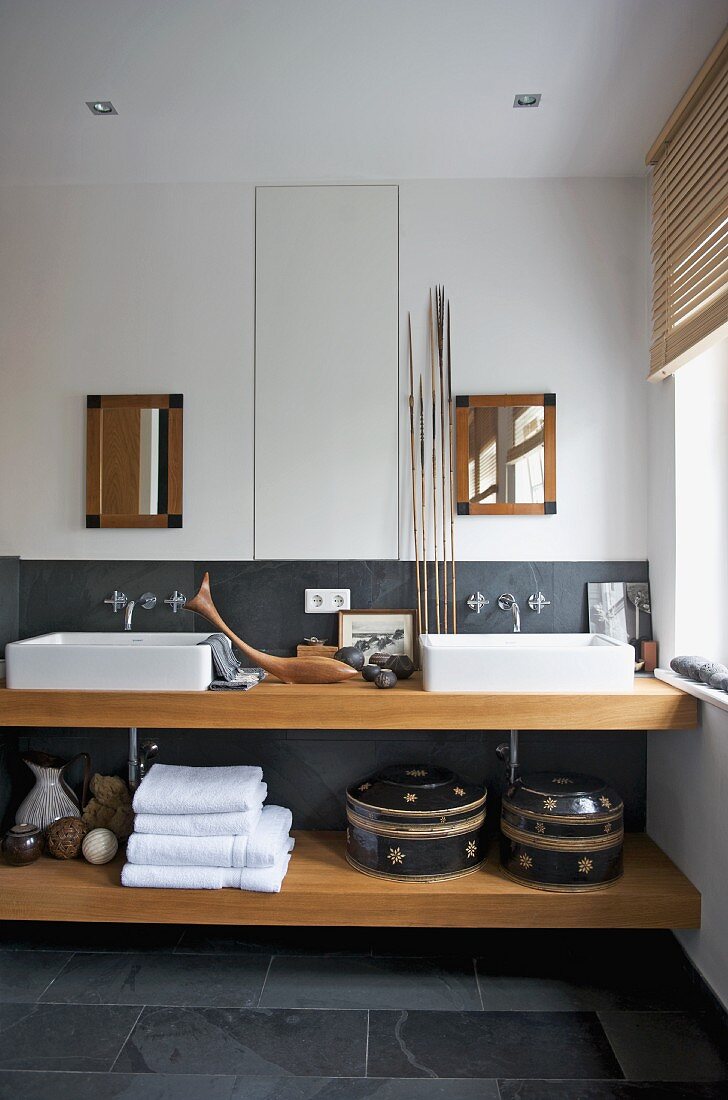 Handcrafted ornaments and grey slate combined with solid beech wood washstand with countertop basins