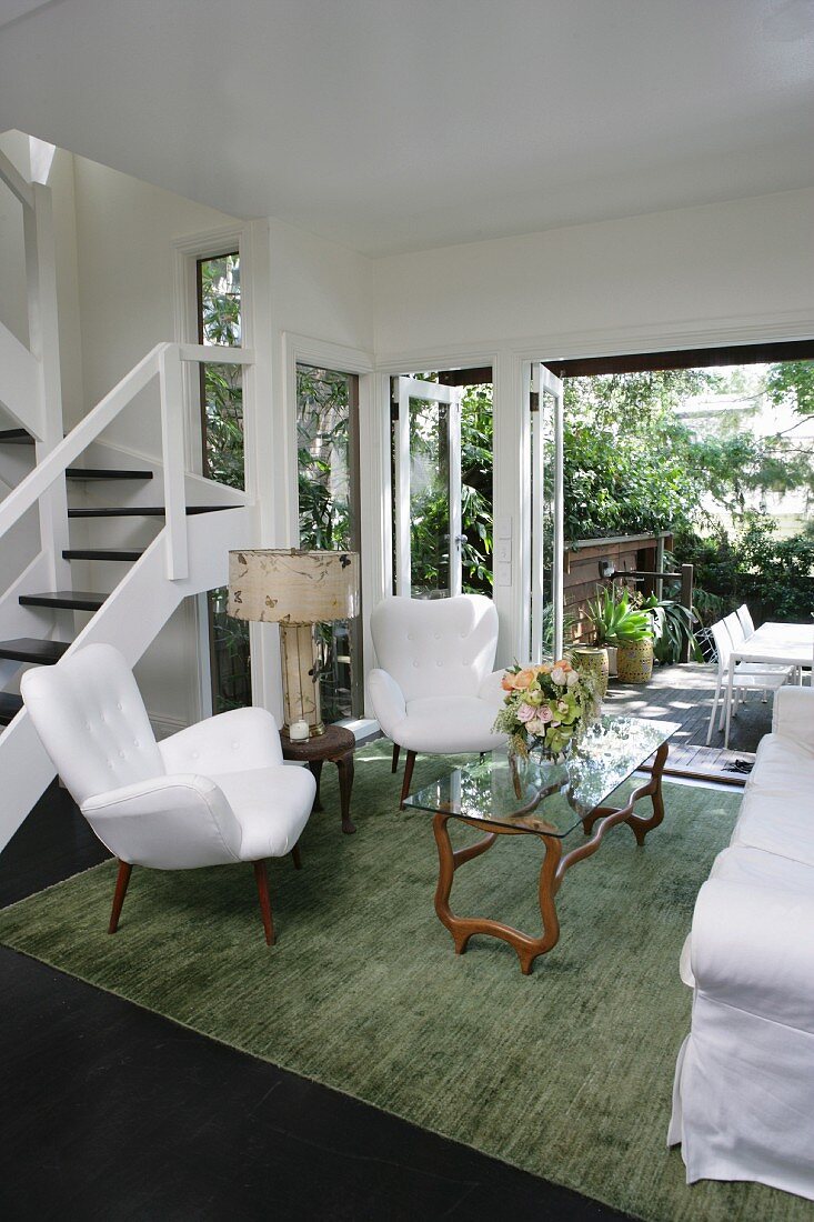 Living room with open door leading to terrace
