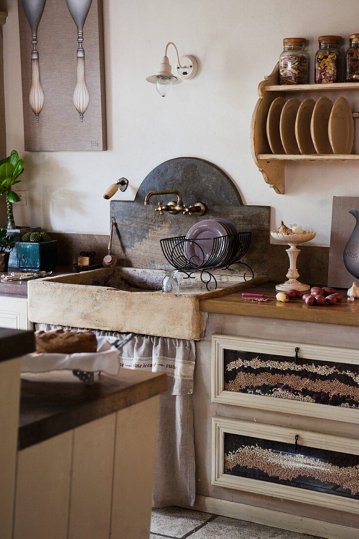 Rustic, stone sink in country-style kitchen