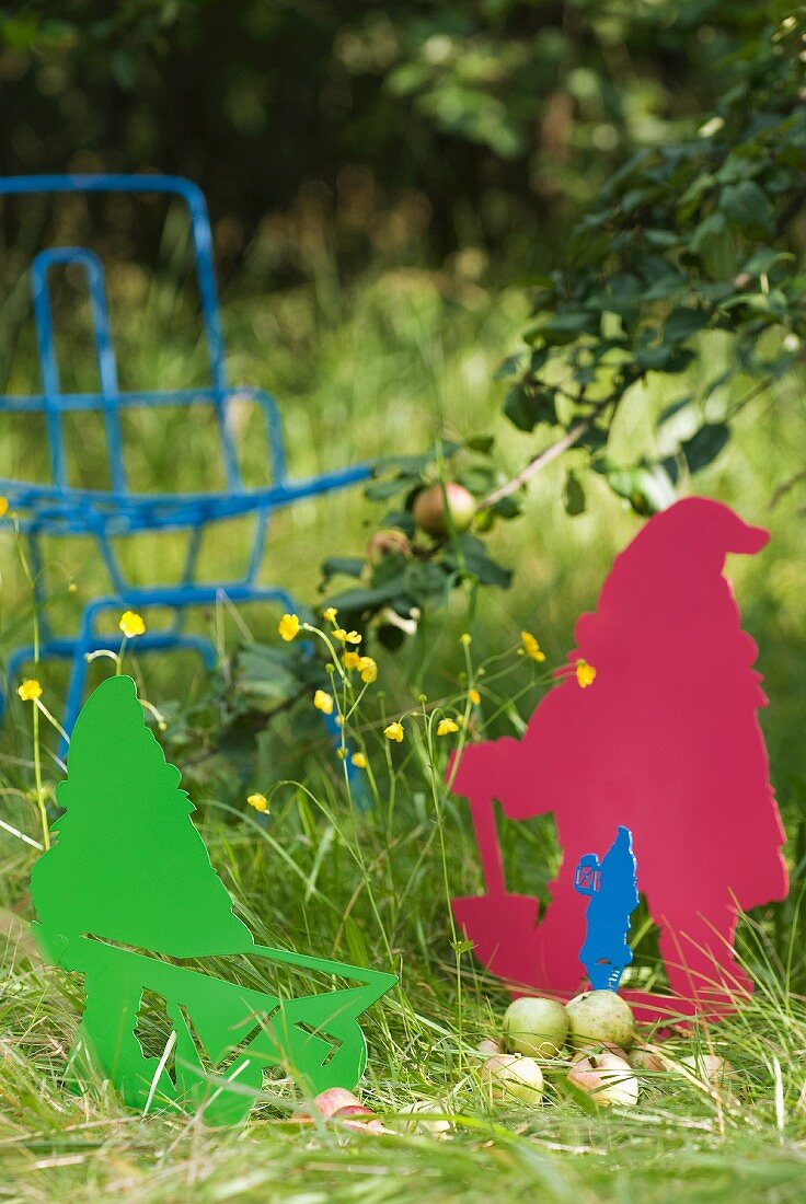 Colourful garden gnomes shaped from sheet metal