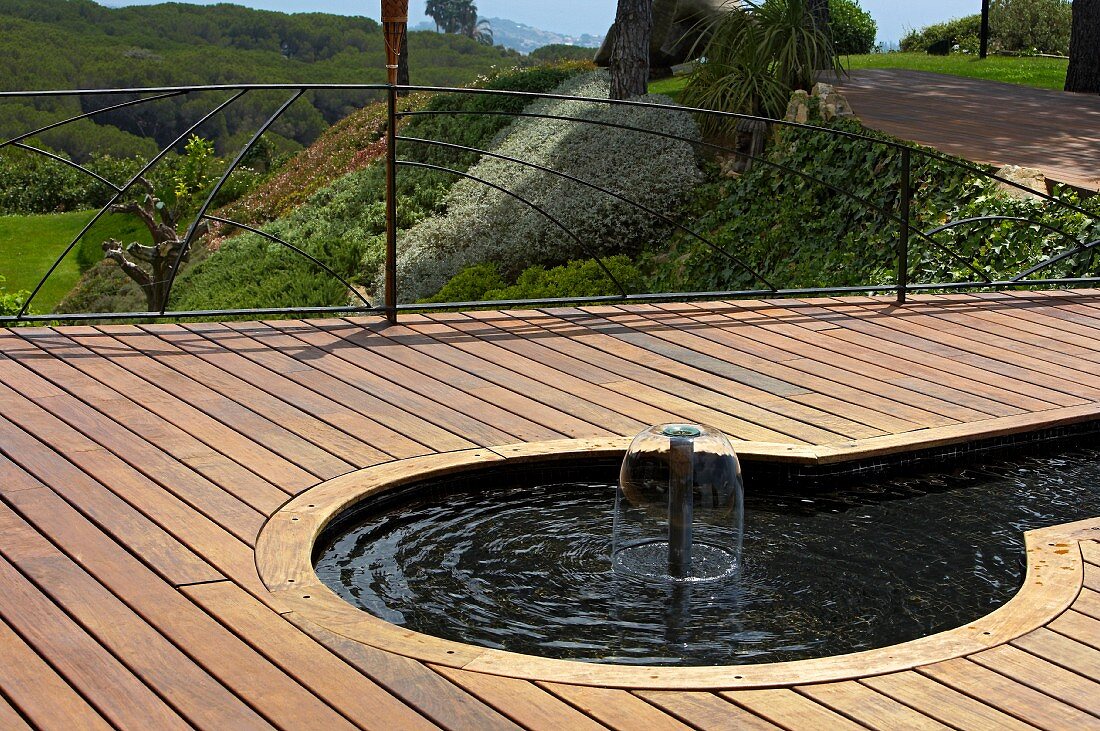 Wooden terrace with water feature