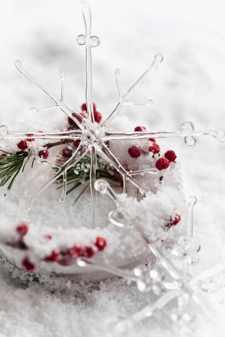 Ice dish with holly berries and glass star ornament