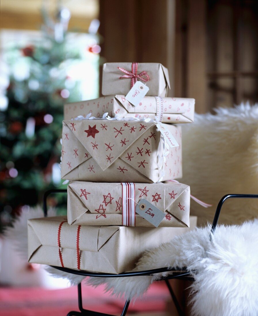 Christmas presents wrapped in hand-decorated paper