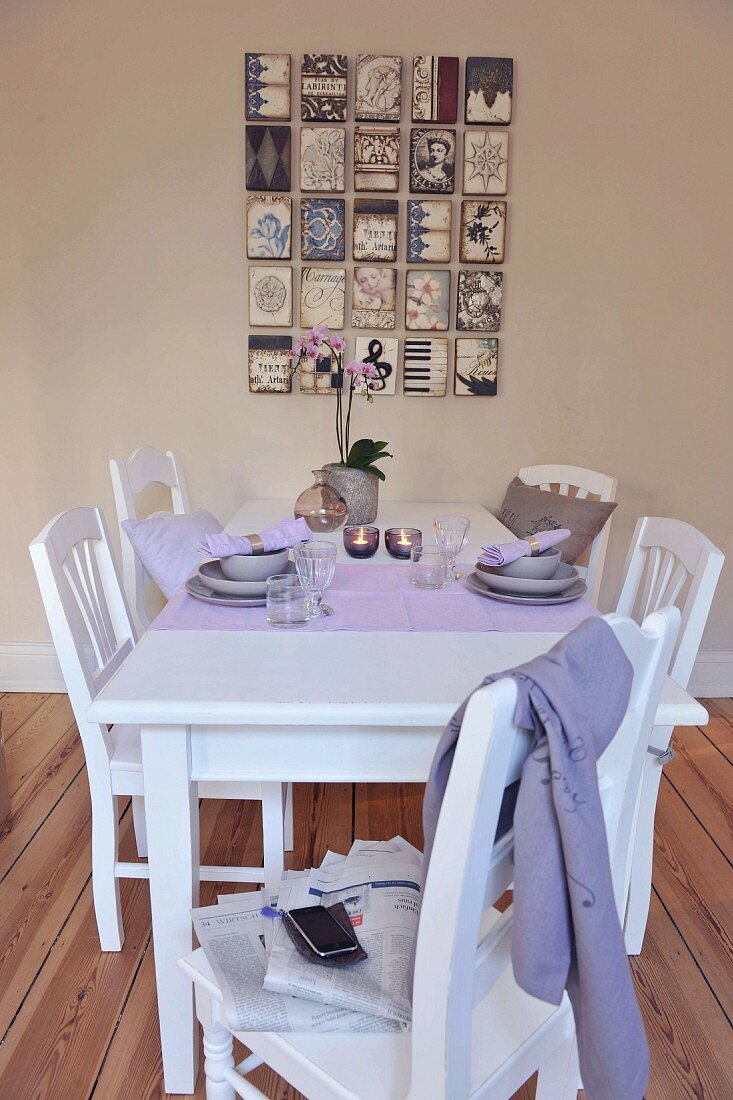 White dining table and chairs with breakfast table settings for two in rustic modern dining room