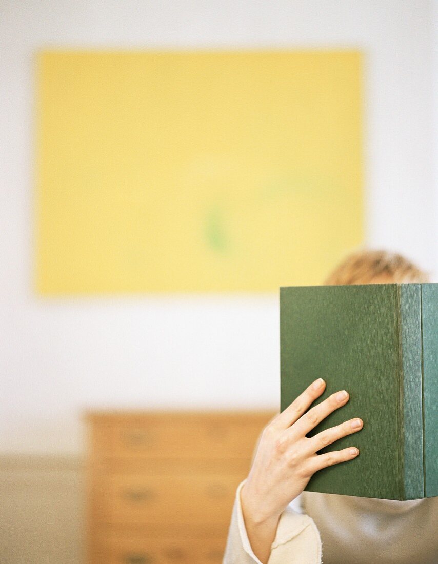 A young young woman reading a book