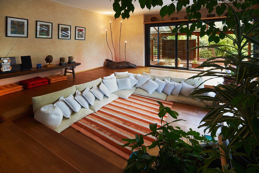 Modern lounge seating in sunken floor of spacious living room