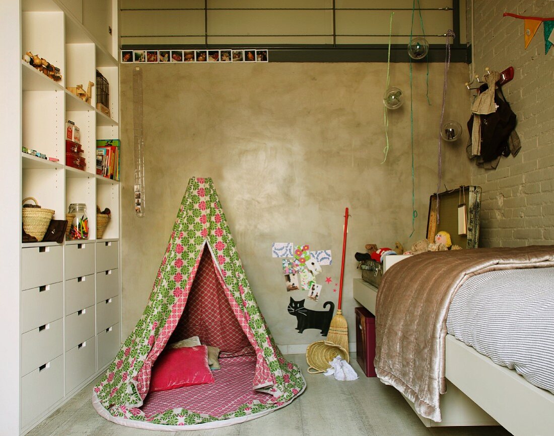 Wigwam between dresser and bed in modern child's bedroom