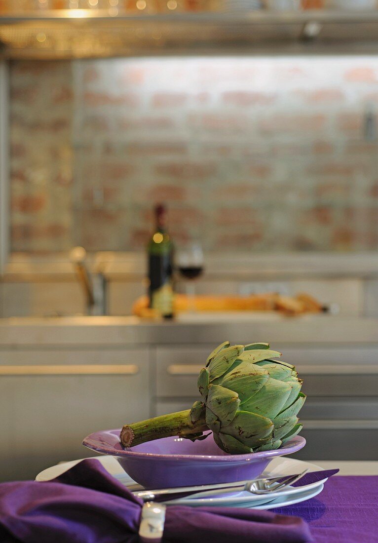 Artichoke on plate in kitchen