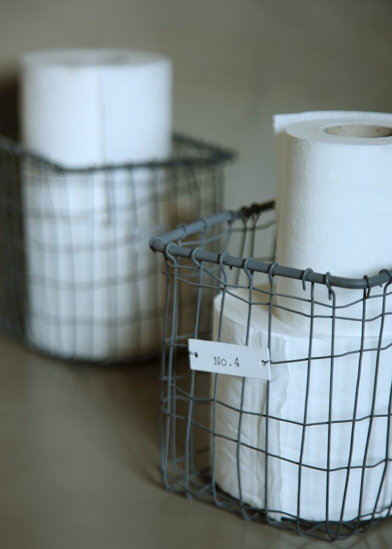 Toilet paper in vintage wire basket