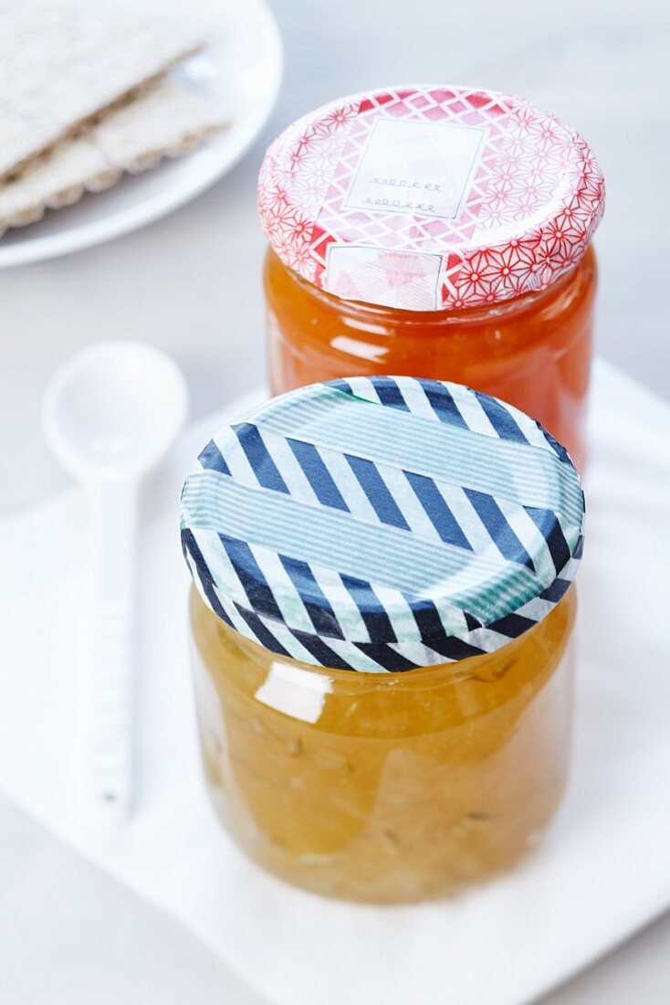 Jars of home-made jam with masking tape stuck on the lids