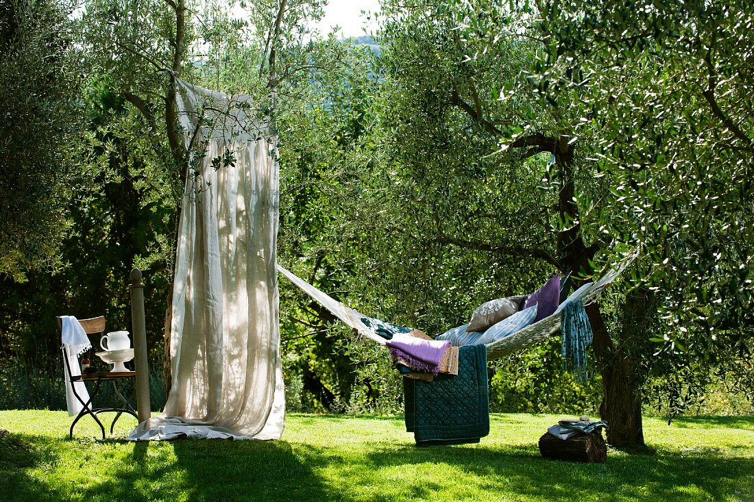 Relaxing in hammock in Mediterranean garden